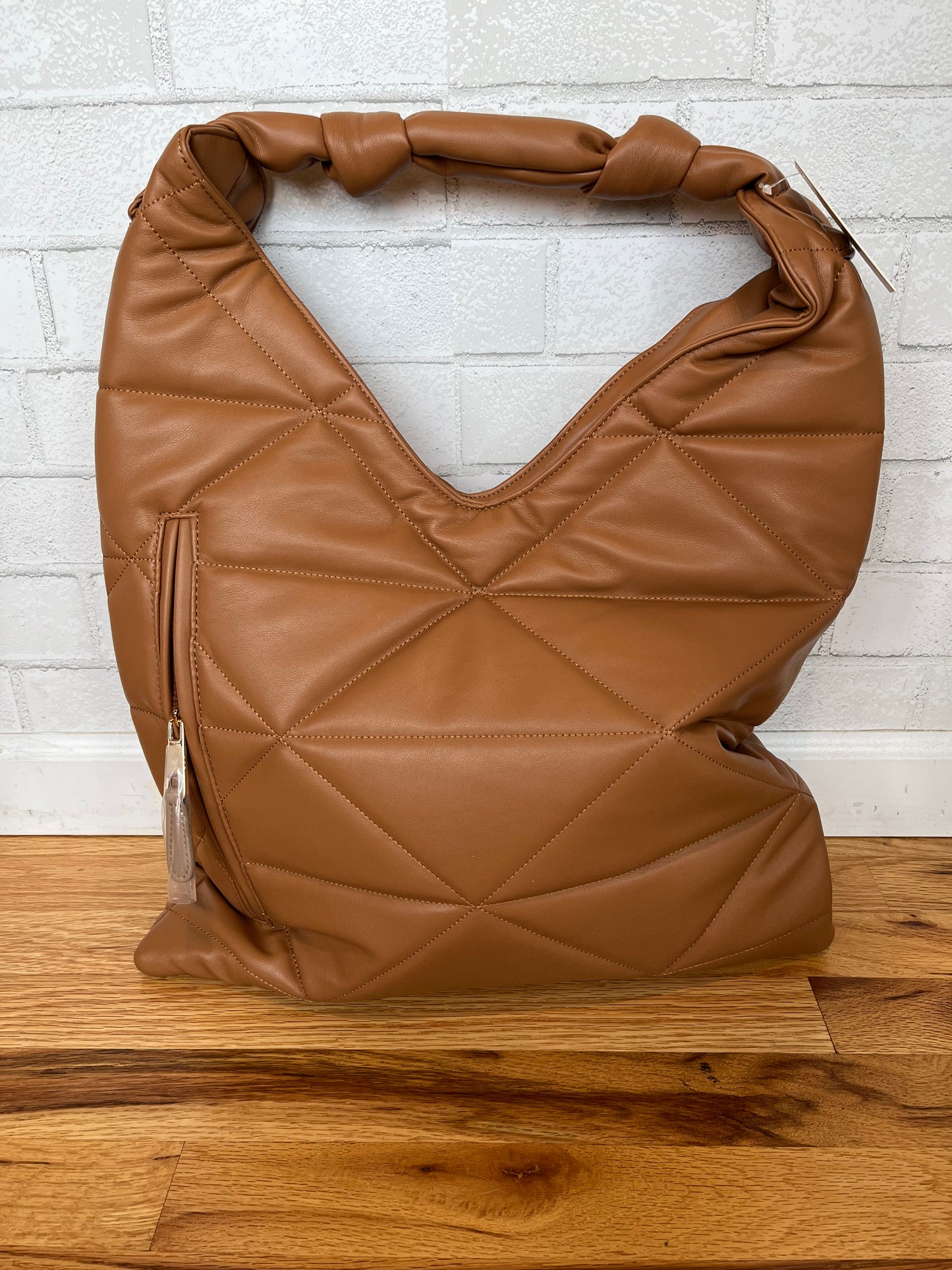 A hobo bag with a knots on the handle. Lots of room for your goodies!