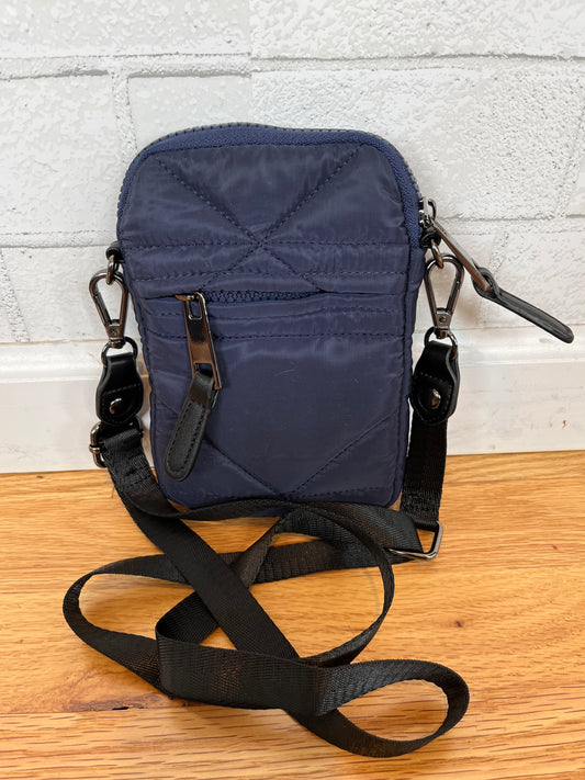 A phone crossbody bag with a thin adjustable strap. Zipper on the outside and a pocket in the front.  
