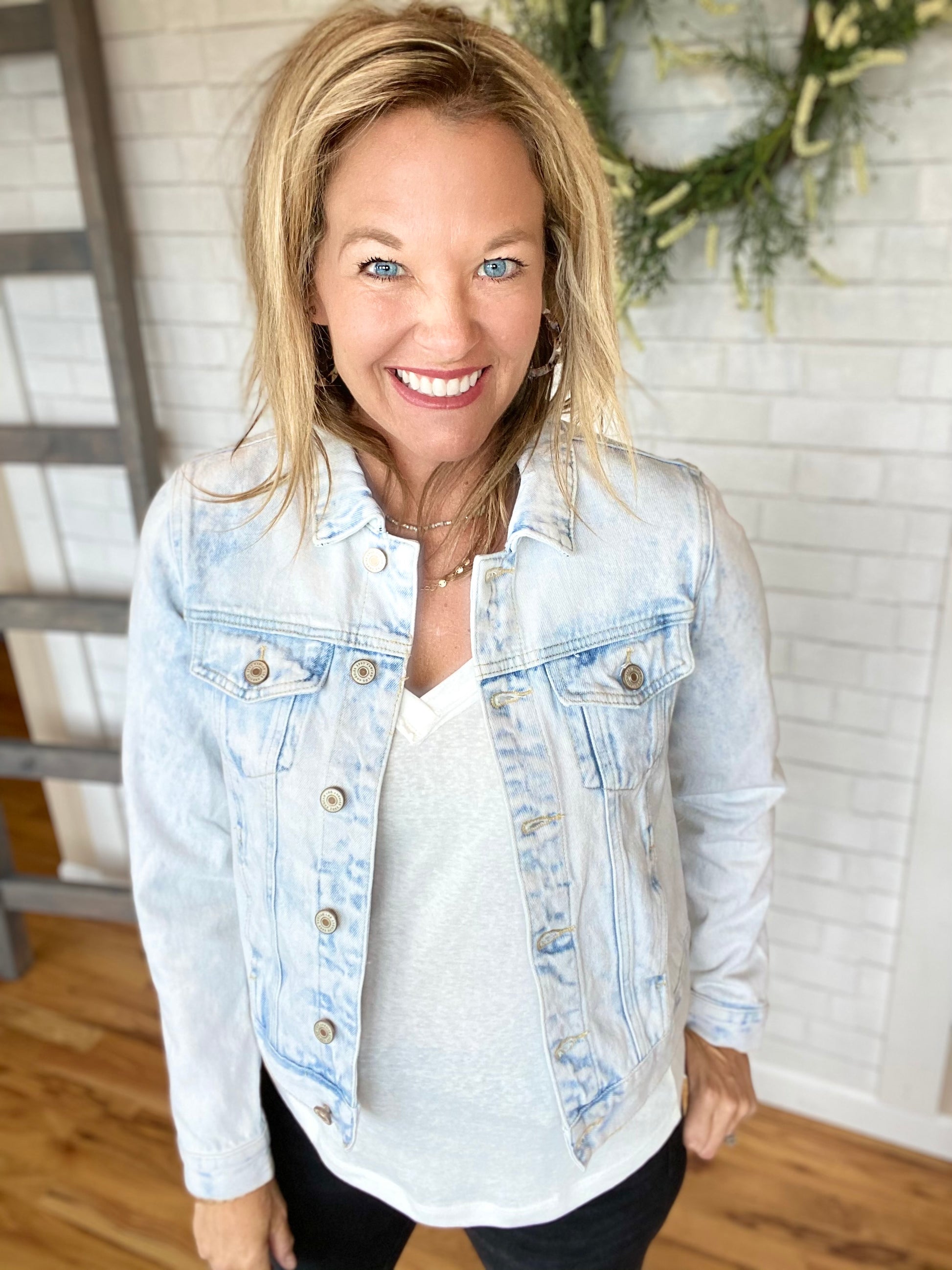 This one almost has a whitewash look to it - this is the one for you if you do not like distressing. Classic jean jacket styling - chest pockets and waist pockets; back tabs at waist. Runs small - no stretch in this one.  Christy is wearing a Medium  100% cotton - no stretch