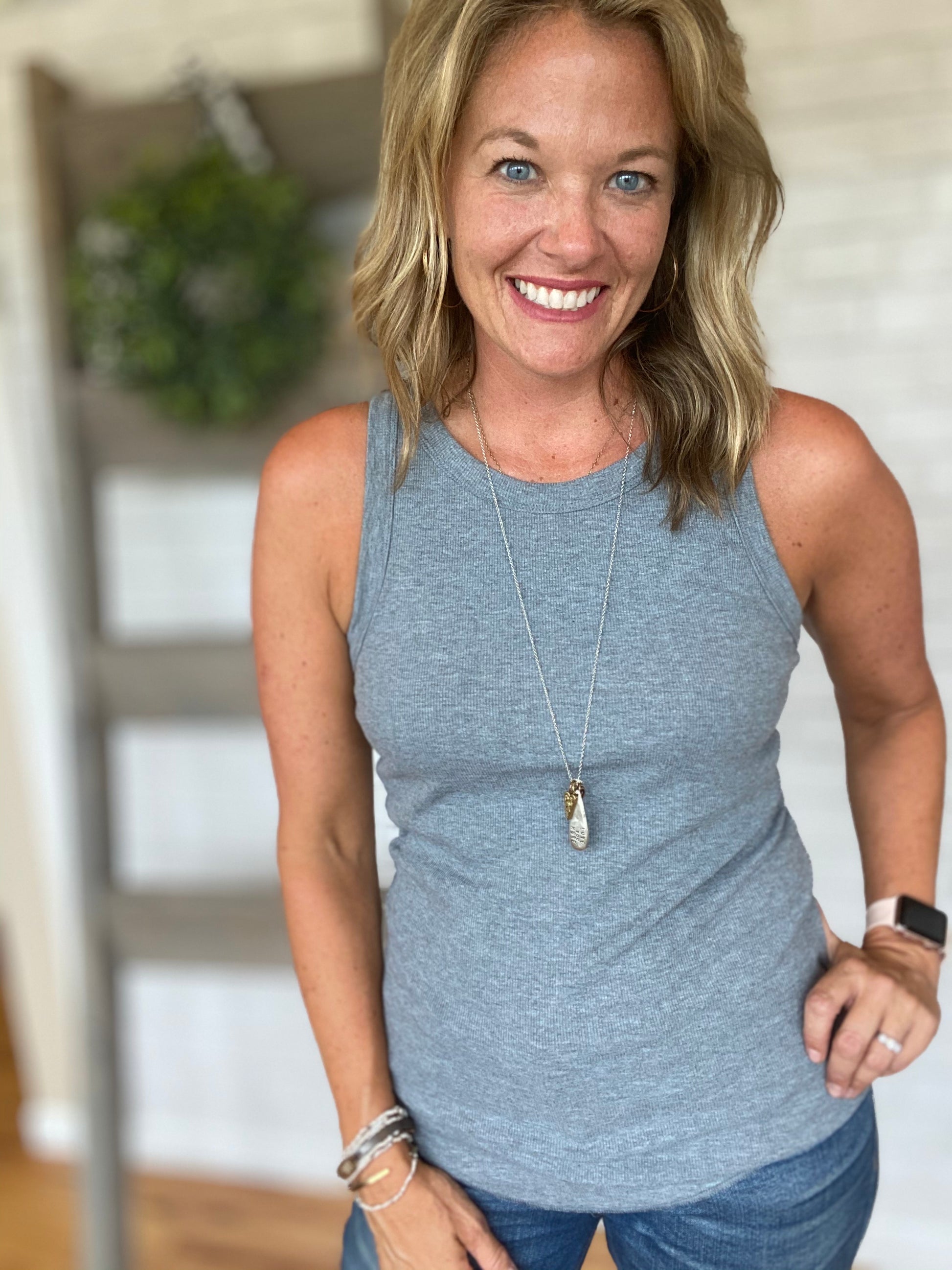 Our favorite tank! A thinly ribbed tank that is more form fitting. A a little longer tank that is easy to tuck into any bottoms. Comes in lots of cute colors! Any size will work depending on what look you are looking for!