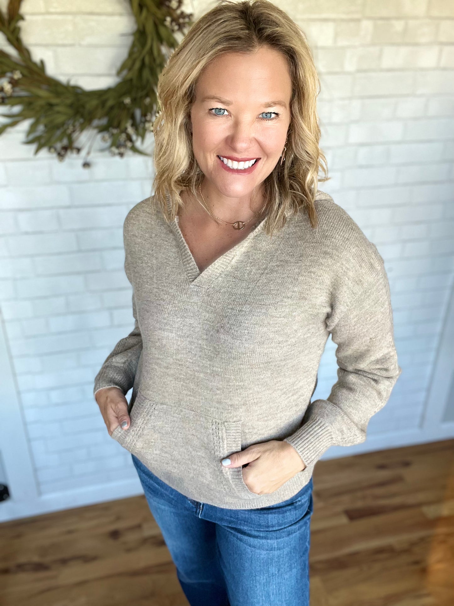 A Pointelle sweater with a hood. The coloring in this top is amazing! An oatmeal and a gray heathering. Fit is true to size. 