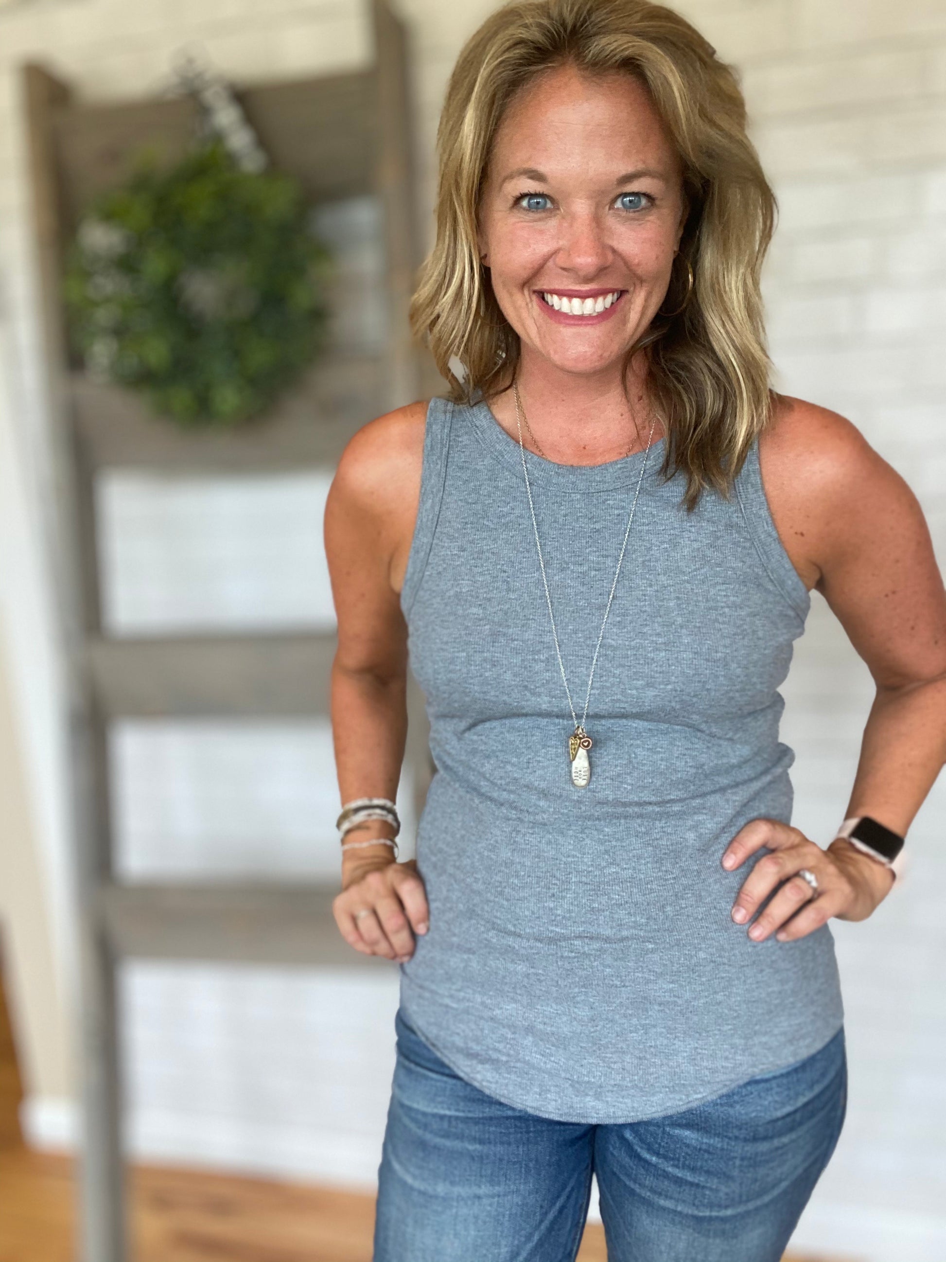 Our favorite tank! A thinly ribbed tank that is more form fitting. A a little longer tank that is easy to tuck into any bottoms. Comes in lots of cute colors! Any size will work depending on what look you are looking for!